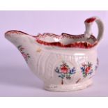 AN UNUSUAL 18TH CENTURY LIVERPOOL CREAMBOAT with serpant biting handle, painted with flowers. 5Ins