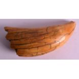 A 19TH CENTURY CARVED WHALES TOOTH of naturalistic form. 5.75ins high.