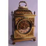 A LATE 19TH CENTURY FRENCH BRASS MANTEL CLOCK with acanthus capped top, the front embellished with