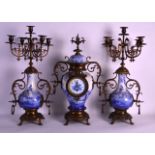 A 19TH CENTURY DELFT POTTERY CLOCK GARNITURE mounted in gilt metal and overlaid with flowers. Mantel