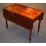 A GEORGE III MAHOGANY PEMBROKE TABLE with drop sides and slender carved legs.