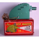 A VINTAGE BOXED THE STIP MASTER 35MM FILM STRIP PROJECTOR.