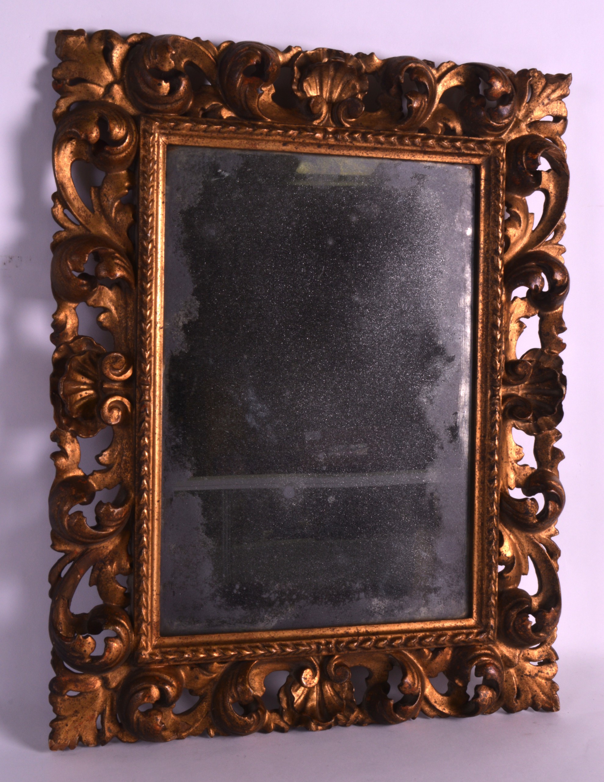 AN 18TH/19TH CENTURY ITALIAN FLORENTINE GILTWOOD MIRROR with scrolling foliate frame. 1Ft 7ins x 1ft