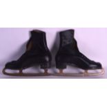 A PAIR OF VINTAGE LEATHER ICE SKATES.