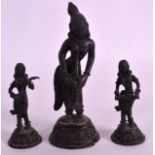 A 19TH CENTURY INDIAN BRONZE FIGURE OF A FEMALE together with a smaller similar pair. 6.5ins & 3.