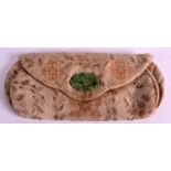 AN EARLY 20TH CENTURY CHINESE SILK PURSE the clasp in the form of a pierced jadeite plaque. 8Ins