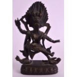 AN 18TH/19TH CENTURY SINO TIBETAN BRONZE FIGURE OF A GOD modelled holding a staff standing upon