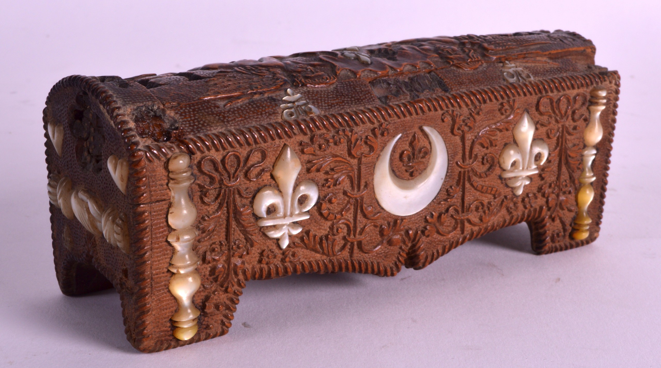 AN 18TH/19TH CENTURY CARVED NORTHERN EUROPEAN MARRIAGE BOX with sliding top, mother of pearl