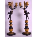 A FINE PAIR OF MID 19TH CENTURY FRENCH EMPIRE CANDLEABRA beautifully cast with two semi clad cherubs