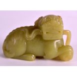 A FINE 19TH CENTURY CHINESE CARVED GREEN JADE FIGURE OF A BUDDHISTIC LION with incised features,