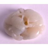 A 19TH CENTURY CHINESE CARVED WHITE JADE OF TWO BEASTS modelled with lingzhi fungus within its