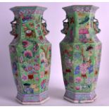 A PAIR OF 19TH CENTURY CANTON FAMILLE ROSE VASES of hexagonal form, painted with precious objects.