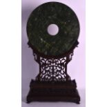 A LARGE CHINESE QING DYNASTY CARVED HARDWOOD FRAMED JADE BI DISC of large proportions. Jade 12ins