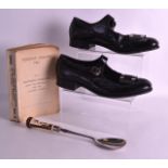 A PAIR OF SCOTTISH BLACK LEATHER SHOES together with a lacquered spoon & a book entitled Holiday