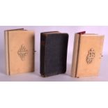 A PAIR OF 19TH CENTURY IVORY BOUND BIBLES together with another bible. Each ivory panel 5ins x 3ins.