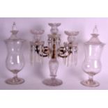 A PAIR OF ANTIQUE GLASS VASES AND COVERS together with a cut glass twin branch candelabra. 1Ft