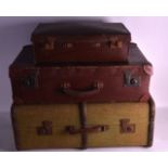 A GROUP OF THREE VINTAGE SUITCASES of various designs and colours. Largest 2ft 3ins wide. (3)