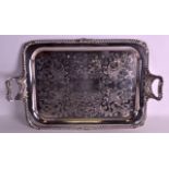 A LARGE LATE 19TH CENTURY SILVER PLATED TWIN HANDLED TRAY with well-cast acanthus capped handles,