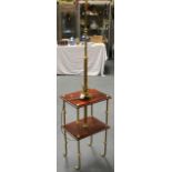 AN EDWARDIAN BRASS STANDARD LAMP with wooden supports. 5Ft 9ins high.