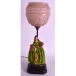 A VINTAGE CHALKWARE CRINOLINE LAMP in the form of a standing lady. Overall 1ft 4ins high.