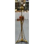 A LOVELY ARTS AND CRAFTS 'DREADNOUGHT' BRASS STANDARD LAMP of highly unusual form, formed with three