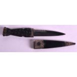 A SCOTTISH SILVER MOUNTED LEATHER CASED DAGGER the top inset with a smoky hardstone. 7.5ins long.