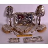 A LOVELY ART NOUVEAU EXTENSIVE SILVER DRESSING TABLE SET wonderfully decorated in relief with birds,