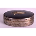 AN 18TH CENTURY CONTINENTAL SILVER AND HORN SNUFF BOX of oval form. 3.5ins wide.