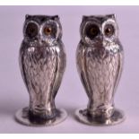 A GOOD PAIR OF ENGLISH SILVER CONDIMENTS in the form of wise owls. Chester 1912. 2ins high.