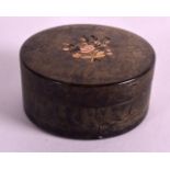 A LATE REGENCY CARVED AND LACQUERED TORTOISESHELL BOX inset with gold foliage. 2.5ins diameter.