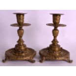 A PAIR OF 19TH CENTURY BRONZE CANDLESTICKS by William Tonks & Sons, with acanthus capped bases,