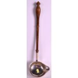A GEORGE III SILVER TODY LADLE with turned wood handle. 11.5ins long.