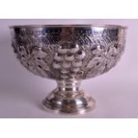A LARGE SILVER PLATED CHAMPAGNE BOWL decorated in relief with acanthus, berries and vines. 11.