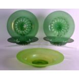 A SET OF FOUR EARLY 20TH CENTURY IRIDESCENT GREEN GLASS BOWLS together with another similar. 13Ins &