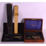 A CASED SET OF EDWARDIAN INSTRUMENTS including a good antique ivory rule etc. (qty)