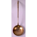 A 19TH CENTURY RUSSIAN SILVER GILT SPOON with turned handle. 7.5ins long.