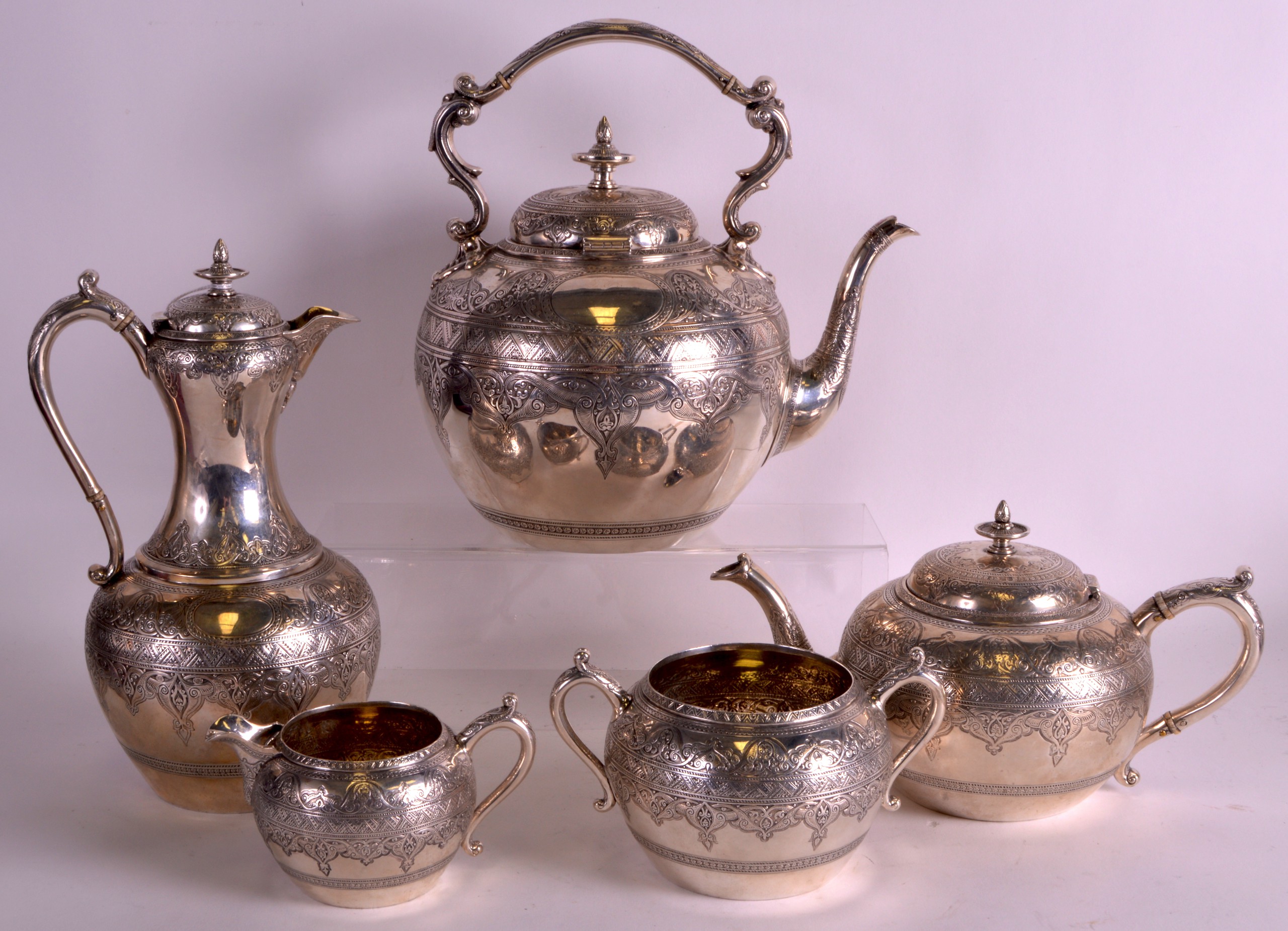 A FINE 19TH CENTURY SCOTTISH SILVER FIVE PIECE TEASERVICE finely decorated all over with incised