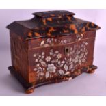 A REGENCY CARVED TORTOISESHELL TEA CADDY of sarcophagus form, mother of pearl inlaid with flowers