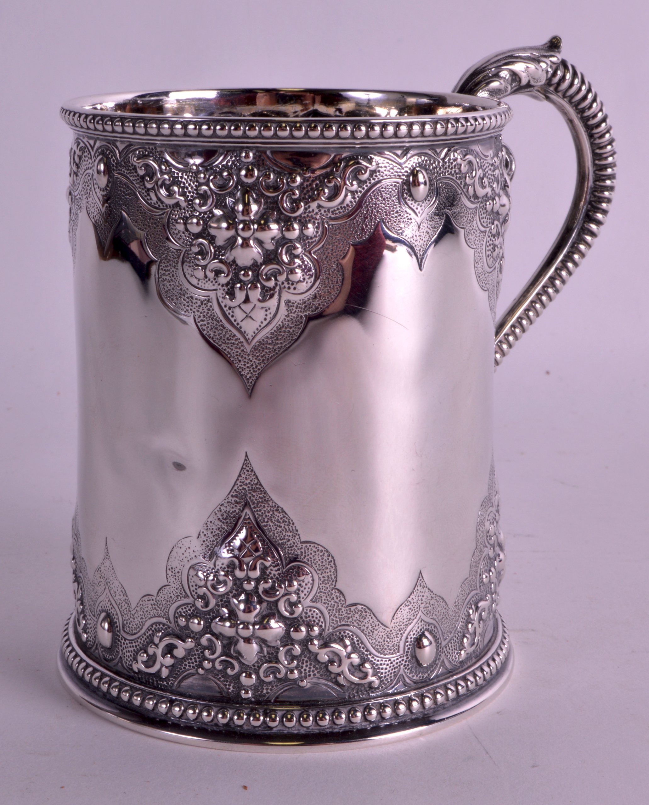 A LOVELY VICTORIAN SILVER CHRISTENING MUG decorated with acanthus and flowers in relief, together
