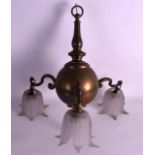 AN EARLY 20TH CENTURY BRASS THREE BRANCH CHANDELIER.