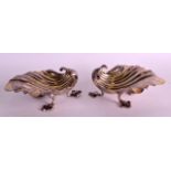 A PAIR OF GEORGE III SILVER SHELL SHAPED SALTS. London 1827. 4ins wide.