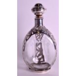 A MEXICAN SILVER OVERLAID 'HAIGS' WHISKEY DECANTER AND STOPPER decorated with foliage. 10.75ins