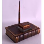 AN UNUSUAL GENTLEMANS INKWELL in the form of a book, with cut glass inkwell. 7.5ins wide.