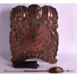 A LOVELY ARTS AND CRAFTS COPPER WALL CLOCK decorated all over with organic scrolling foliage and