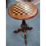 A VICTORIAN WALNUT CHESS TABLE with scrolling acanthus capped legs. 1Ft 10ins diameter.