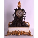 A 19TH CENTURY FRENCH BRONZE AND GILT BRONZE MANTEL CLOCK modelled as two classical figures under