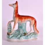 A VERY RARE STAFFORDSHIRE FIGURE OF A STANDING FOX modelled upon a naturalistic base. 7.5ins high.