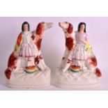 A VERY RARE PAIR OF STAFFORDSHIRE FIGURES OF LARGE HOUNDS modelled with young children beside