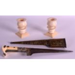A PAIR OF 19TH/20TH CENTURY IVORY CARVED CANDLESTICKS with square stepped bases, together with an