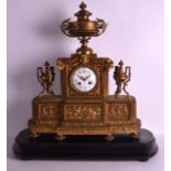 A MID 19TH CENTURY FRENCH BRONZE MANTEL CLOCK modelled in the classical style, the gilt and black